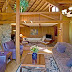 The living room, river rock fireplace and grand piano.