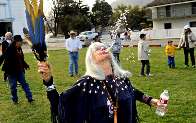 Laynee Reyna spits water during a rain dance in San Juan Bautista, California, on a Sunday in early 2014. 'Water attracts water,' she said. Residents of the town of San Juan Bautista have turned to traditional Native American dances to bring rain during a record three-year drought. Photo: Wally Skalij