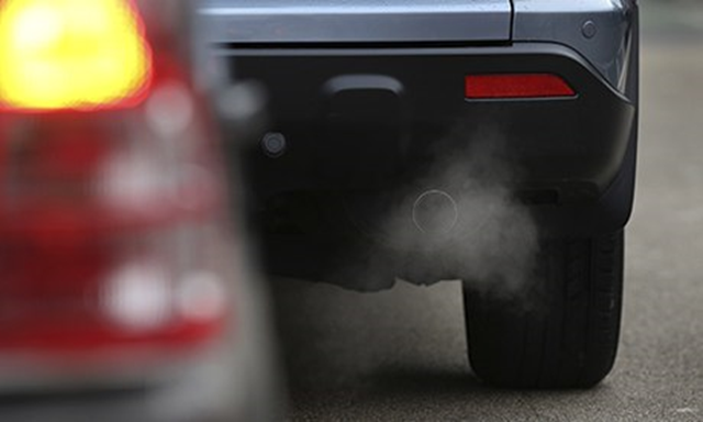 Exhaust fumes from a car. Babies born to mothers who live in areas with air pollution and dense traffic are more likely to have a low birthweight and smaller head circumference, according to a large European study in 2013. Photo: Peter Macdiarmid / Getty Images