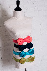 Are your fiance's groomsmen donning bow ties? Have your bridesmaids mirror their look with a bow-tie-like belt.