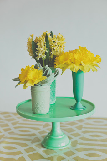 Consider placing three small vases together on a cake stand for added height.