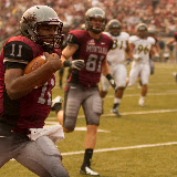 Trent McKinney crosses the goal line for his first touchdown of the day.  McKinney struggled to pass effectively but was a serious threat on the ground during Saturday's game.  Washington-Grizzly Stadium in Missoula, MT, Sept. 22nd, 2012.