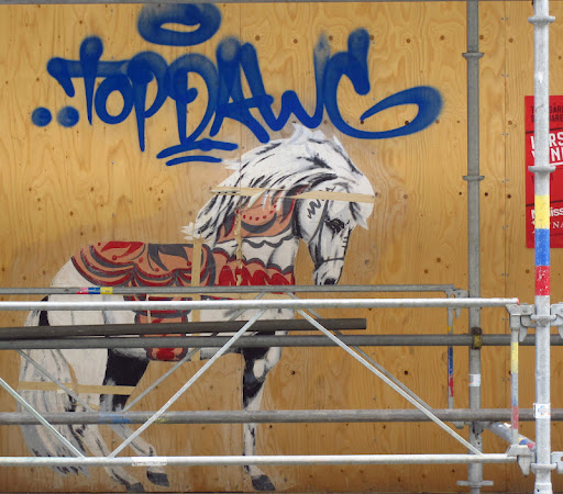 This image was painted on a city scaffold- pretty neat.  Made me think of Delia and her stunning horses!.