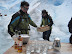 Our guides preparing whiskey on (glacial) ice.