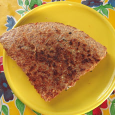 Roasted vegetable, goat cheese, and spinach quesadilla with spicy tomato jam