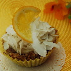 Lemon Pudding Filled Coconut Cupcakes with Shaved Coconut Topping