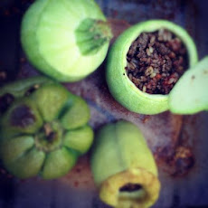 Green peppers and summer squash stuffed with ground beef, rice and spices