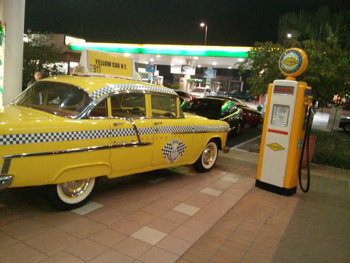 Old Yellow Cab and Pump