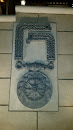 Medallion mural Above Fountain 