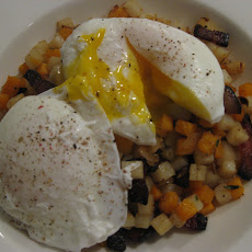 Mixed potato hash with bacon and eggs