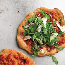Individual Pizzas with Pecorino, Arugula, and Tomatoes