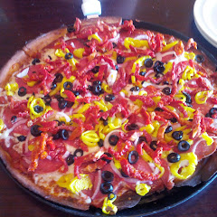 Mediterranean with salami, sun dried tomatoes, red onion, banana peppers and black olives