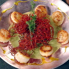 Pan-Seared Scallops with a Fried Red Beet Nest, English Pea Puree, and Curry Oil