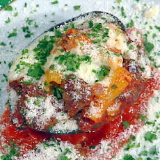 Baked Acorn Squash Filled with Italian Sausage and Rigatoni Pasta