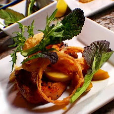 Grilled Pork Chops with Sauteed Apples, Onion Rings and Mustard Greens