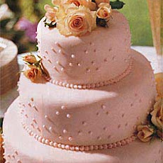 Fondant-Covered Wedding Cake with Raspberries and Chocolate