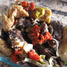 Baho (Beef, Plantains and Yuca Steamed in Banana Leaves)