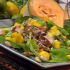 Marinated and Grilled Chicken Salad with Tropical Fruits, Marcona Almonds, Baby Lettuces and Lemon-Ginger Vinaigrette