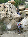 Michael and Bradley climbing boulders