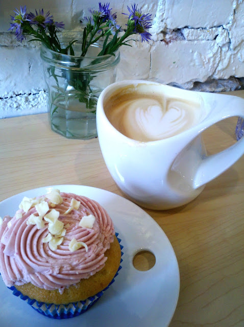 GF cupcake w/ raspberry icing and honey-vanilla latte made by Sarah