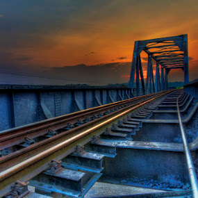 The Track by Charliemagne Unggay - Transportation Trains ( building, railway, sunset, bridge, architecture )