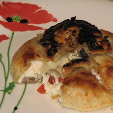 Brie En Croute Stuffed with Olives & Roasted Peppers