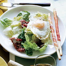Fried-Egg Caesar with Sun-Dried Tomatoes and Prosciutto Breadsticks