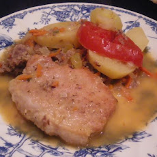 Schweinskoteletten  Mit  Bratwurt  Und  Kartoffeln