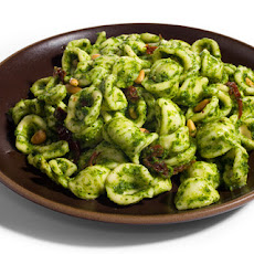 Pasta with Arugula Pesto, Sun-Dried Tomatoes, and Pine Nuts Recipe