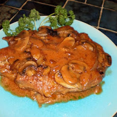 Smothered Pork Chops With Tomato Cream Gravy