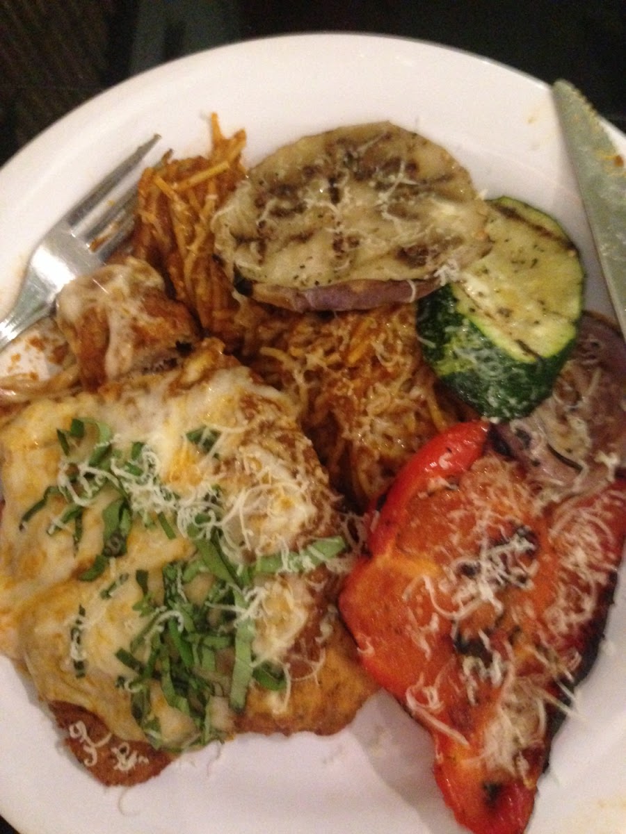 Chicken Parmesan with noodles and roasted vegetables.