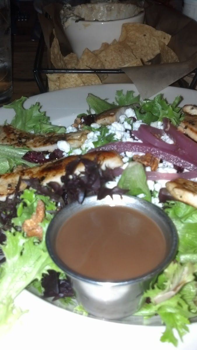 Delicious salad with fruit, goat cheese, grilled chicken, balsamic vinaigrette.