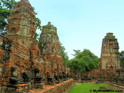 The remain of some prangs and Buddha images without head
