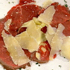 Seared Beef Carpaccio with Shaved Fresh Artichokes and a Drizzle of Truffle Oil