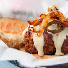 Burgers With Caramelized Onions, Jalapeño Relish And Red Pepper Mayonnaise Recipe