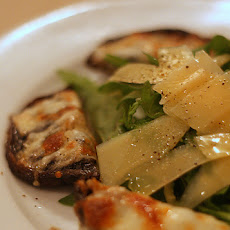 Grilled Portobello Mushrooms With Garlic, Cheese and Pine Nuts