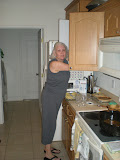 Mom A getting stuff down from the cabinet.