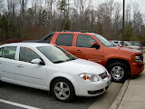 The Avalanche parked next to Chantel's car.  The size difference really shows.