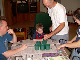 Pierre helping Jay dye some eggs.