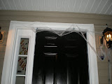 Even more above the door with a window gel decal that says:  Scary Night