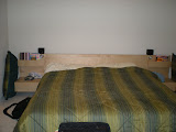 Our bed in our bedroom.