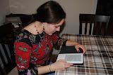 Katie reading her Kindle