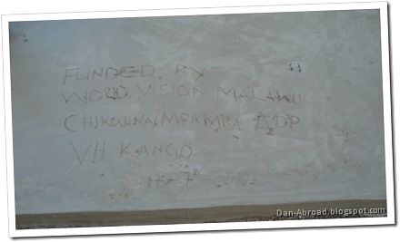 This reads: Funded by World Vision Malawi, Chikwina/Mpamba ADP, VH (village headman) Kango