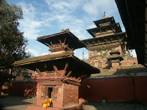 On the left on Durbar Square is the octagonal Krishna Temple which Pratapa Malla built in memory of two of his favorite queens