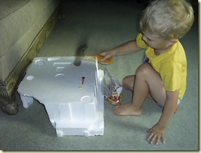 hammering golf tees into styrofoam