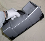Astrotech's hand-held analyzer, shown in relation to an operator.