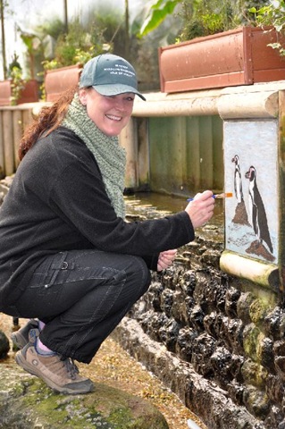 [Julie touching up paintings in Tropical House March 11[5].jpg]