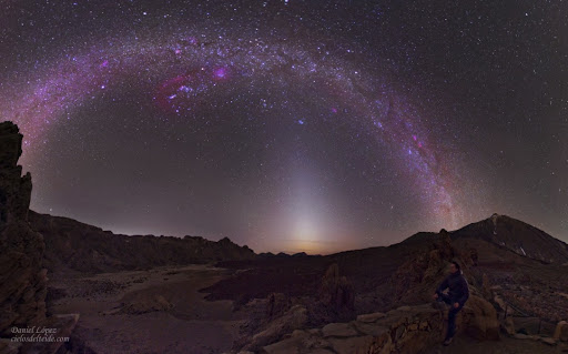 In the picture, the narrow triangle of Zodiacal light extends above the western horizon and seems to end at the lovely Pleiades star cluster. Arcing above the Pleiades are stars and nebulae along the plane of our Milky Way Galaxy. Recorded on March 10 from Teide National Park on the island of Tenerife, the vista is composed of 4 separate pictures spanning over 180 degrees. 