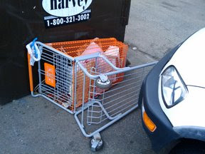 Home Depot cart near dumpster, nowhere near a Home Depot