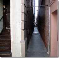 Entrance to Fan Tan Alley from Fisgard St. in Chinatown.  Many of the old doorways have been bricked in now.